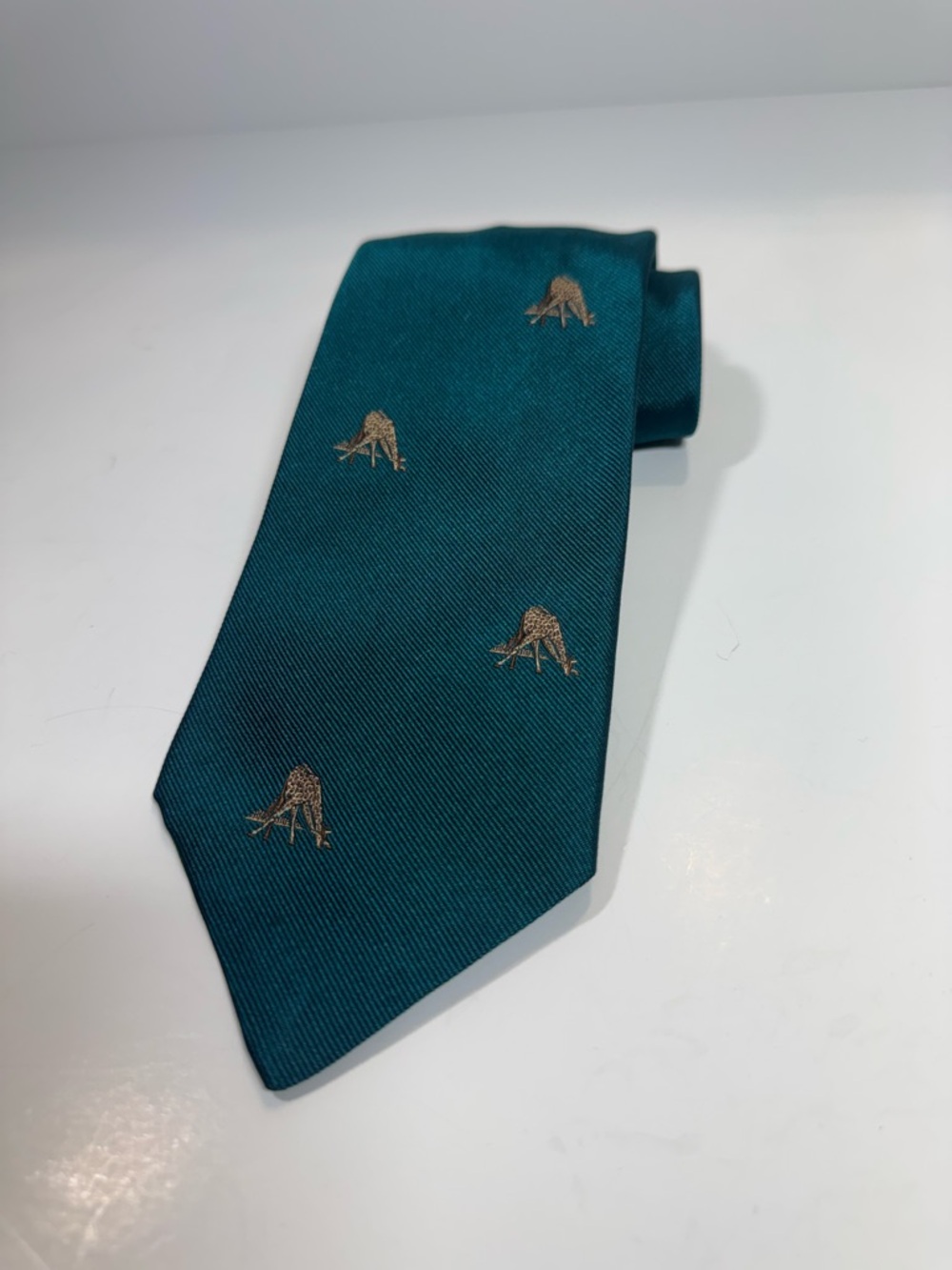 Hermes Teal Silk Tie with embroidered tan giraffe Motifs